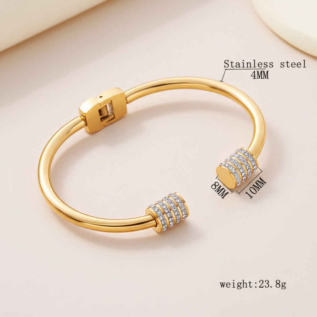 Open bangle bracelet with zirconia accents.