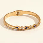 18K Gold Plated Bangle with Blue Eye Motifs and Zirconia Accents